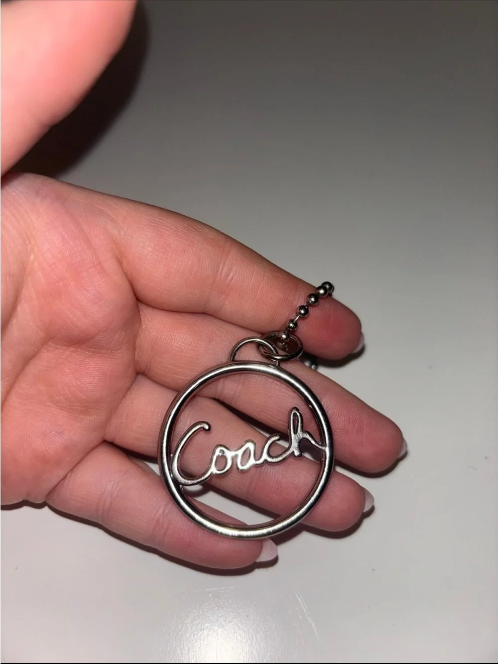 Coach Silver Script Circle Keychain